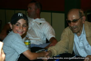 Yogi and the boy Yogi Berra greets a young Yankees fan.